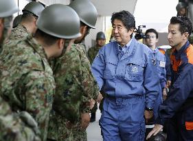 Japan PM Abe visits typhoon-affected areas