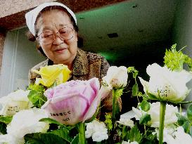 Roses bearing messages of encouragement in petals