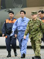 PM Abe takes helicopter tour over typhoon-damaged area