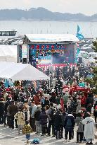 Oyster festival in quake-hit town