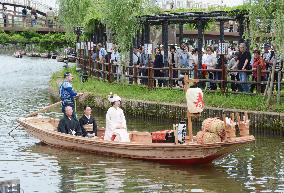 Boat carries bride to the groom in traditional wedding custom