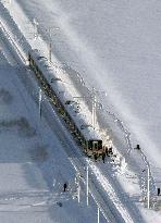 Train stranded by heavy snowfall in Japan