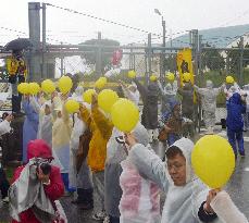 17,000 people encircle Futemma base in 'human chain'
