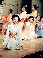 Geisha rehearse traditional dance performance