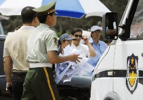 Police keep watch at Tiananmen Square on 18th anniversary