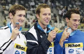 Medalists of men's 100 meters breaststroke