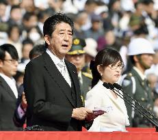 Japan PM pitches SDF's new overseas duties at review ceremony