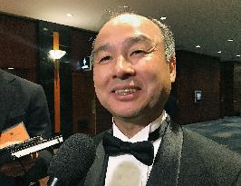 SoftBank chief says mulling investment in Uber