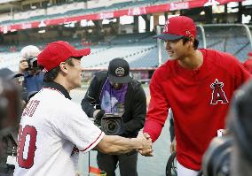 Baseball: Takuma Sato throws ceremonial first pitch