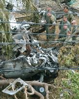 U.S. military officials investigate crash site