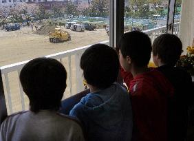 Removing topsoil from Fukushima school playgrounds