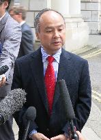 SoftBank's Son meets with British PM May