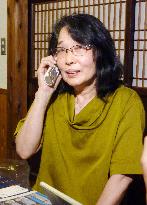 Nobel laureate's wife talks with husband on phone