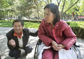 Chinese court imprisons activist couple