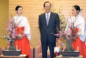 Fukuda receives flowering plum bonsai from shrine's 'Plum Missio