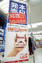 Nintendo launches palm-sized Famicom game console amid fanfare