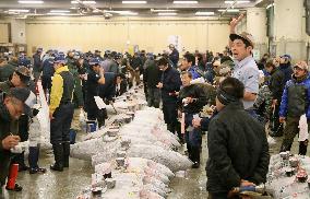 CORRECTED: Tsukiji fish market holds final New Year auction