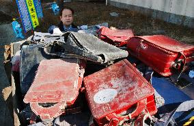 Unclaimed school backpacks pulled from tsunami debris incinerated