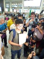 H.K. student activist Joshua Wong returns after detention in Thailand