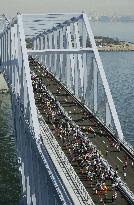 Running across Tokyo Gate Bridge