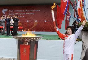 Olympic torch feted by masses in Pyongyang