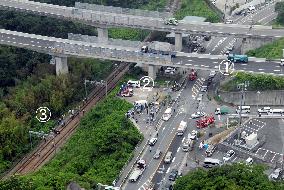 2 killed after car falls off highway and jumps over train tracks