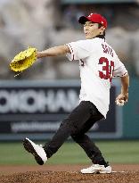 Baseball: Takuma Sato throws ceremonial first pitch