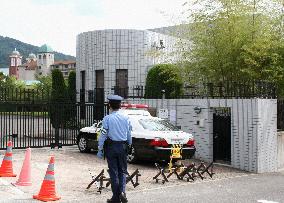 Man held after throwing flare at China consulate general