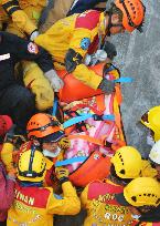 Girl rescued from collapsed apartment complex in Taiwan