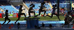 Olympic scenes: Steeplechase runners clear water pit