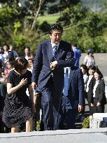 Japan PM Abe visits father's grave