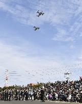 Japan PM pitches SDF's new overseas duties at review ceremony