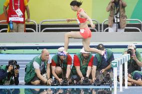 Olympic scenes: Photographers waiting along track