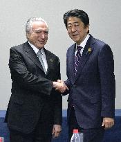 Japanese PM Abe, Brazil's new president holds 1st talks