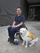 FEATURE: Service dog user hopes every dog has its day