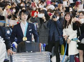 Olympics: Japanese athletes return home