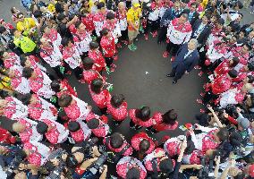 Japanese athletes form multiple rings