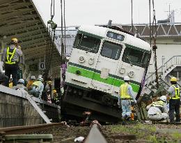 Derailed train car put back on railway tracks