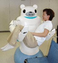 Tokai Rubber, Riken devise nursing-care robot to carry people