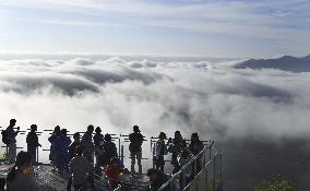 Tourists view "sea of clouds" in Hokkaido
