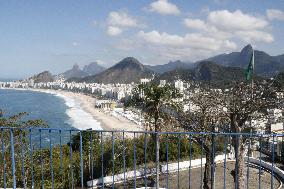 Olympics: Olympic torchbearer king of hill at Copacabana Beach