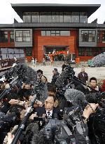 Moritomo Gaken chief Kagoike speaks to reporters