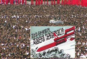 CORRECTED 100,000 N. Koreans rally over ship sinking