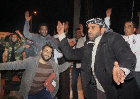 Libyan protesters celebrate