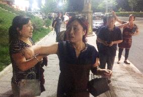 People in quake-hit area in China evacuate on false rumors