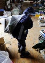 Boy carries bag of memorable items