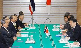 Abe, Surayud hold talks