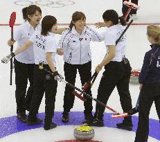 Japan edges out U.S. for 1st win in women's curling