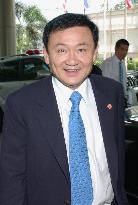 Thai premier Thaksin rebuffs resignation call after election