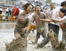 Rugby in muddy rice fields in Japan